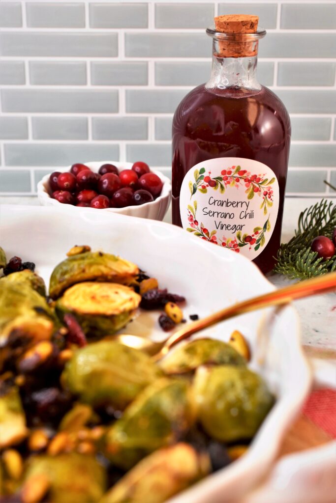 brussels sprouts with cranberry serrano chili vinegar with pistachios and dried cranberries