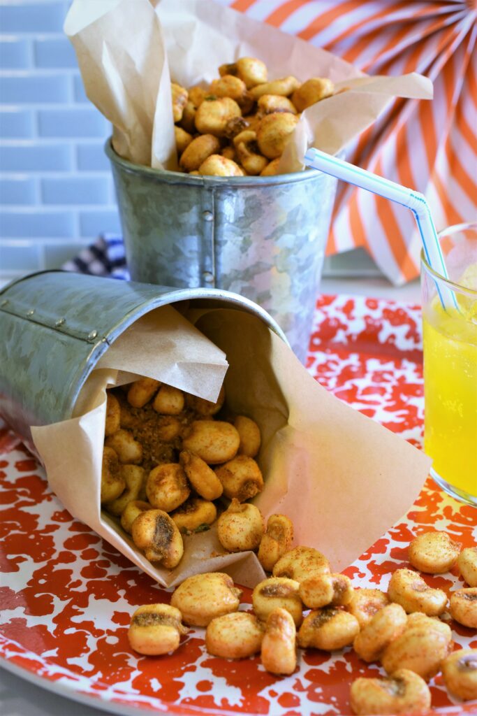 crunchy after school snack pouring out of tipped over galvanized cup on serving tray 