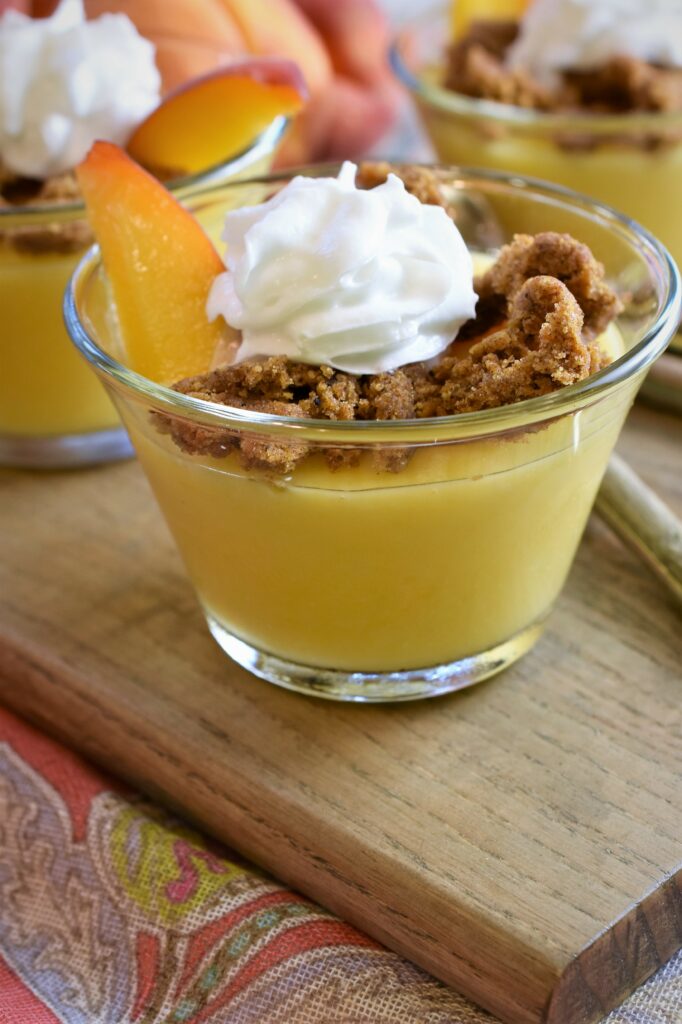 up close shot of pudding on board with colorful pink paisley napkin