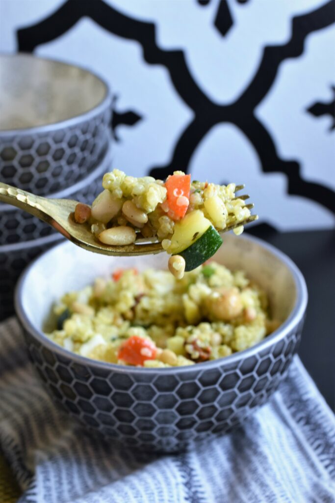 forkful of pine nuts vegetables and grains