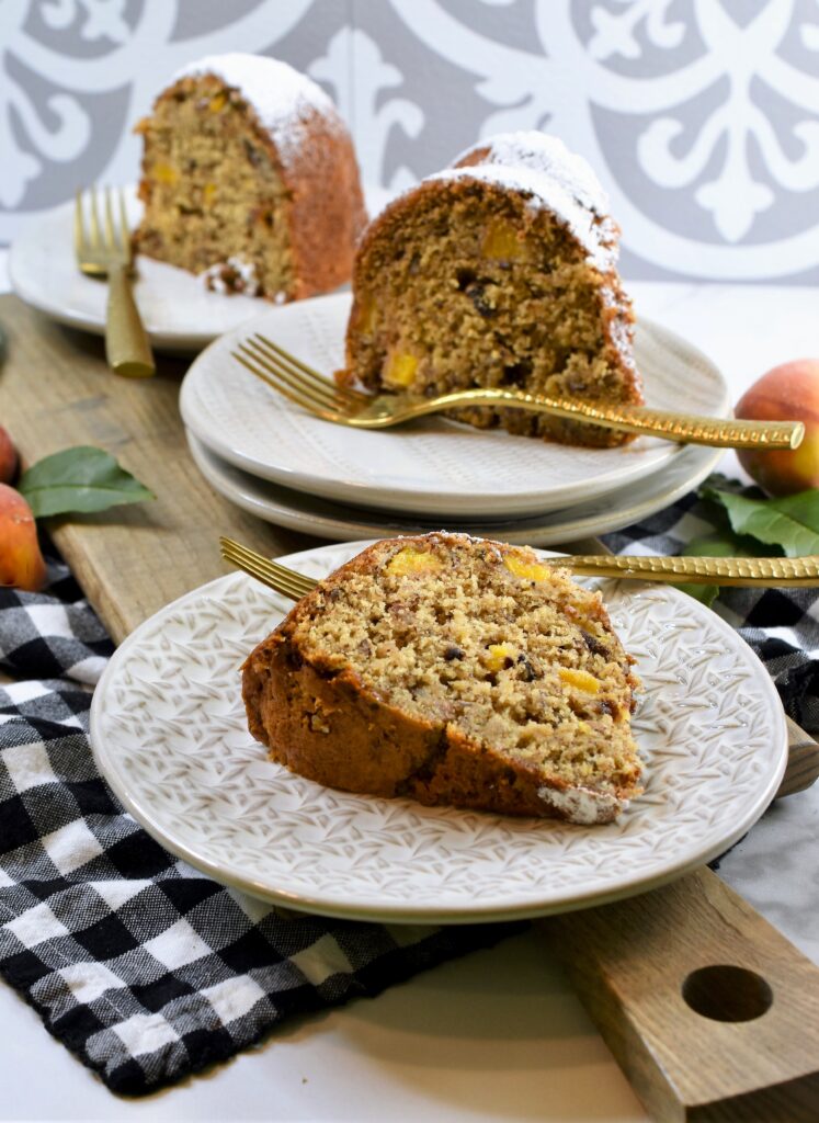 individual plate with slices of bundt cake with gold forks