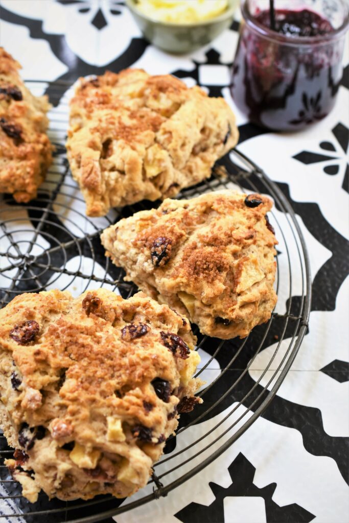 fresh baked scones on cooling rack on black and white Mexican tile countertop