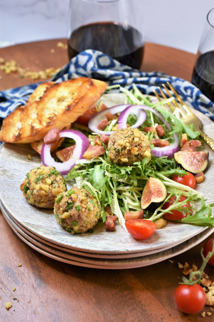 fig blue walnut truffle on frisee salad with crispy pancetta