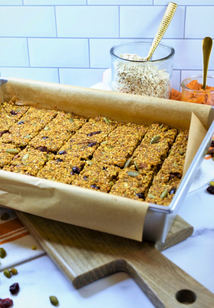 baking pan filled with fresh baked cranberry pistachio pumpkin bars